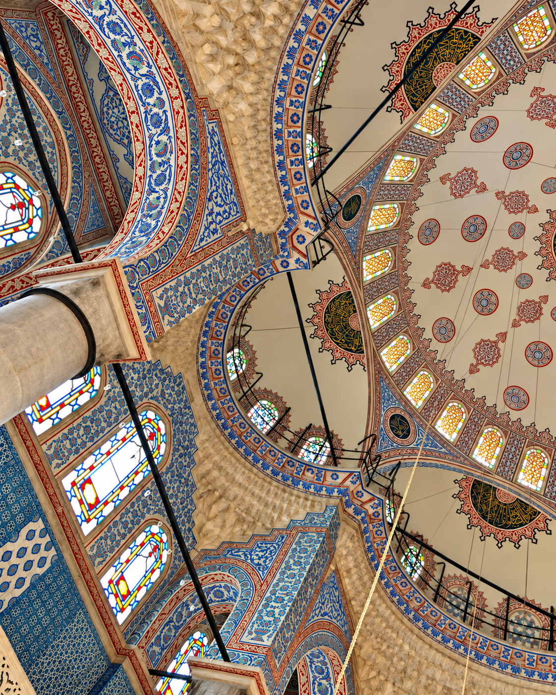 Blue Mosque Istanbul Ottoman Domes and Islamic Art Interior architectural detail of the Blue Mosque in Istanbul, featuring ornate domed ceilings, intricate blue and gold geometric patterns, floral decorations, and traditional Ottoman Islamic ornamentation.