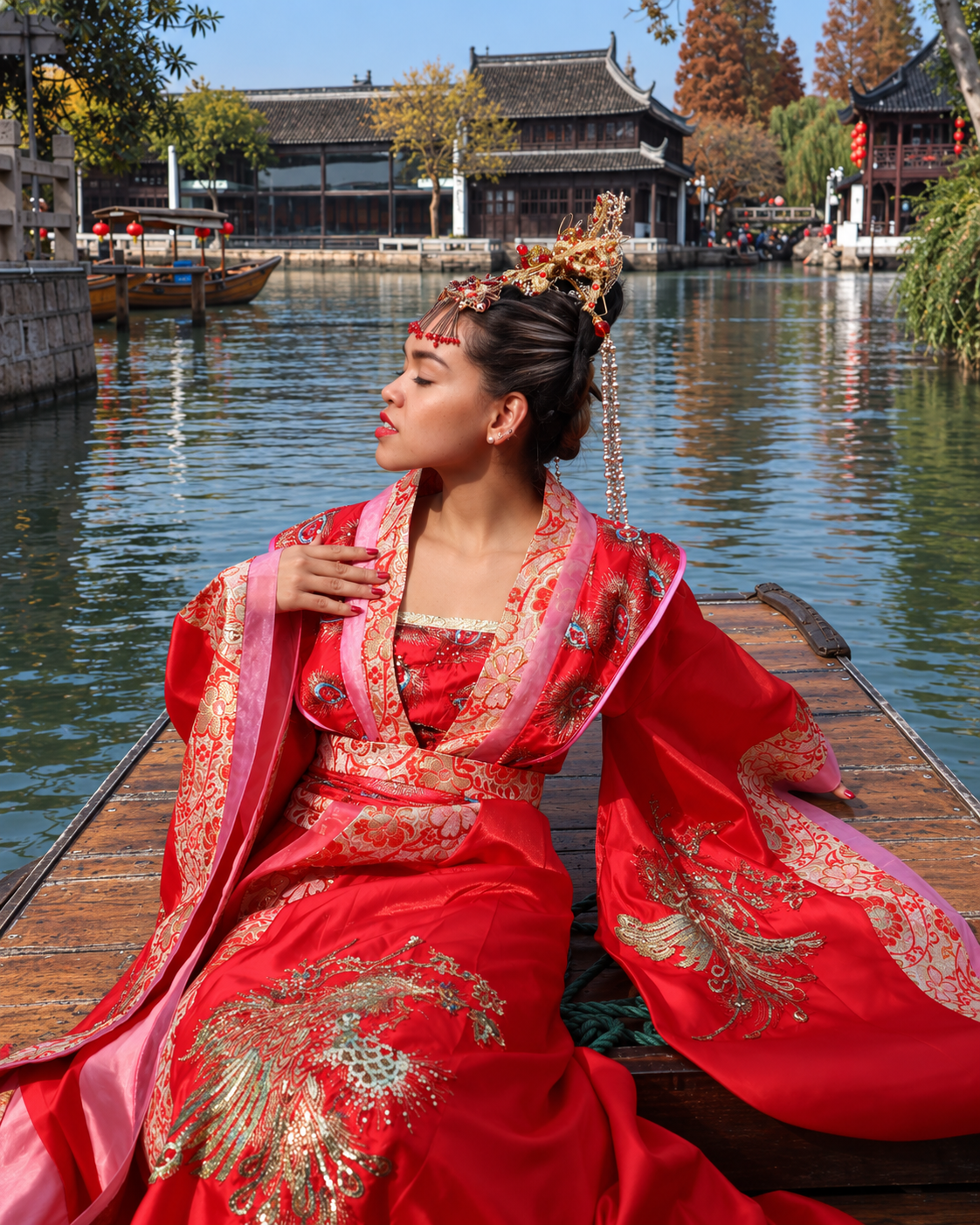 Rosi Ross wearing an elegant red traditional Chinese Hanfu beside a lake during her years living in China.