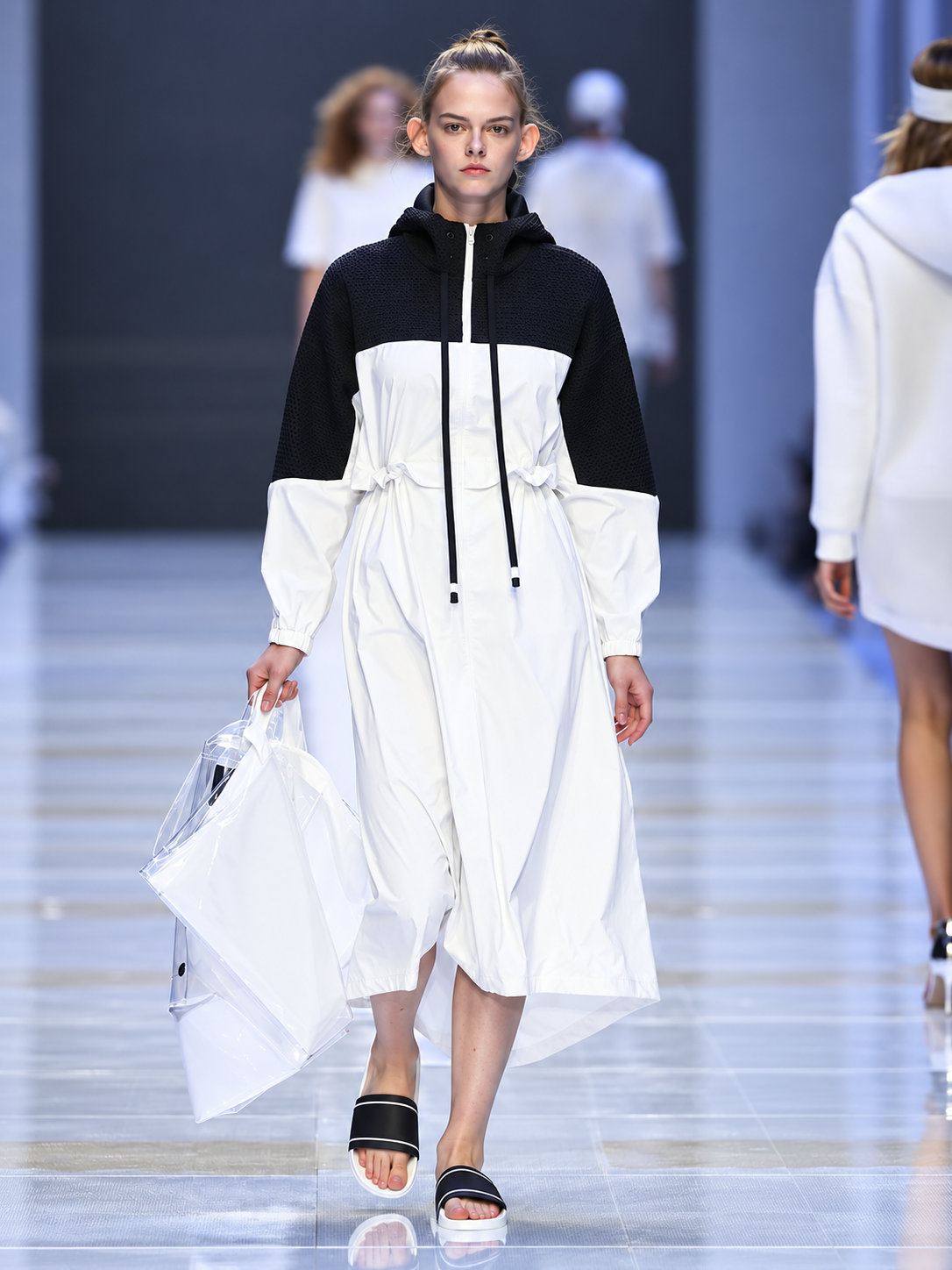 White layered fashion look presented during the Lafuma runway show at Shanghai Fashion Week in China.