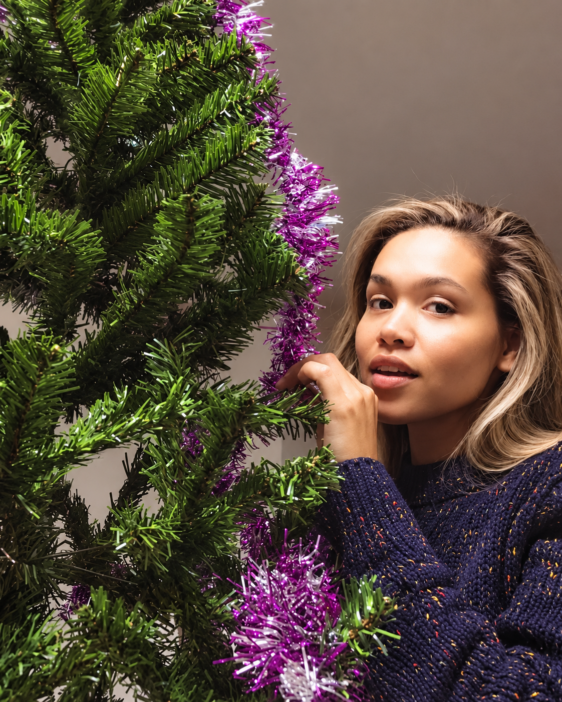 Rosi Ross decorating her Christmas tree at home in Shanghai during the festive holiday season in China.