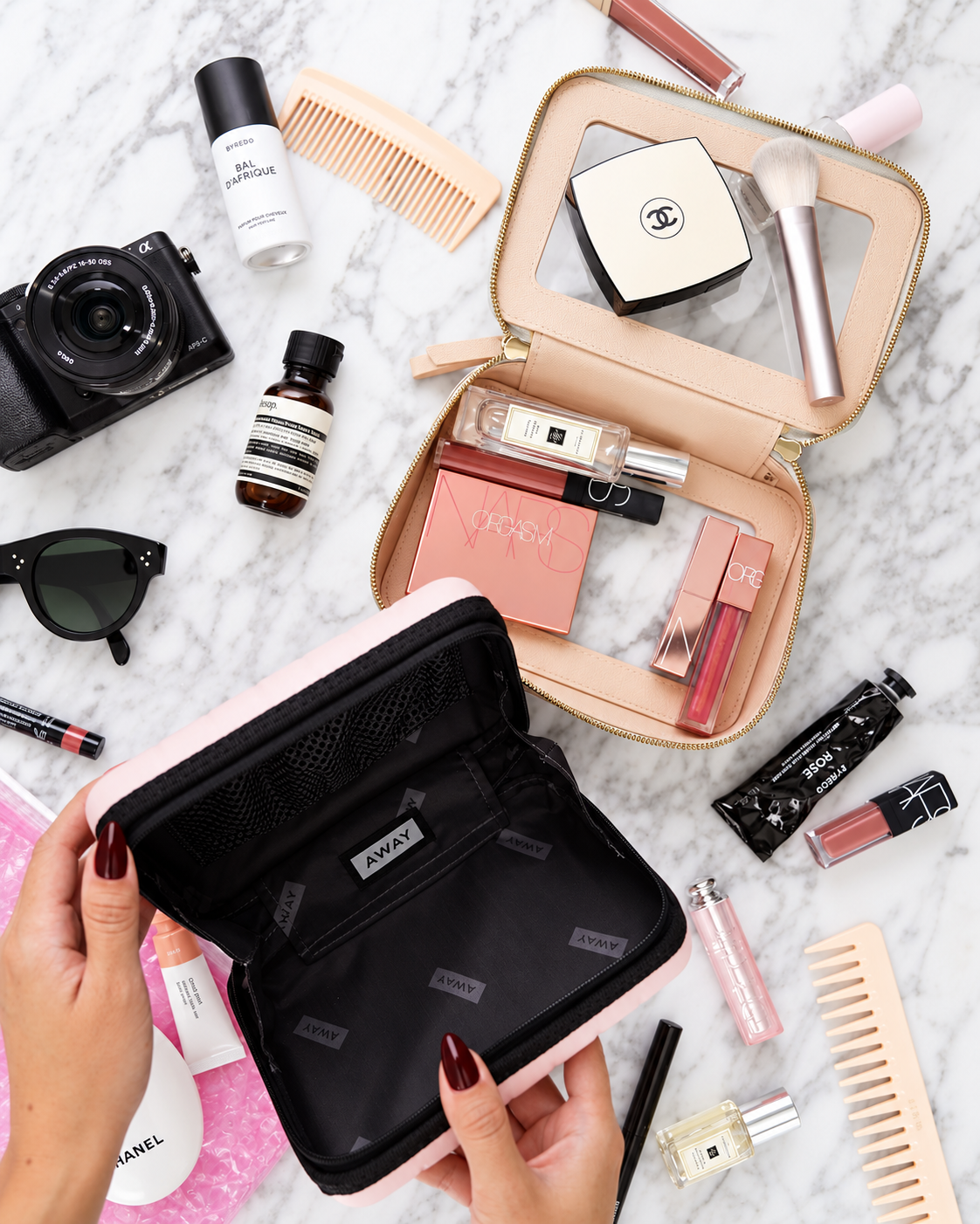 Rosi Ross packing a minimalist travel beauty kit with essential makeup, skincare, and compact products following a less-is-more approach.