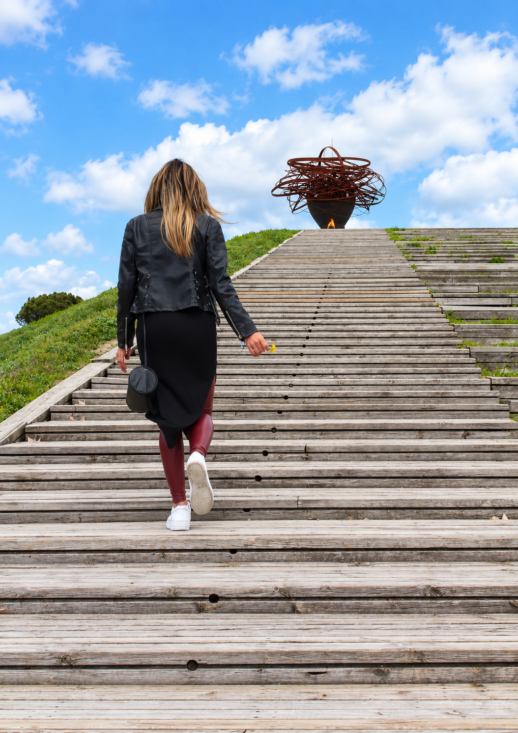 Rosi Ross walking through the architectural landscape of Parque Lineal del Manzanares Madrid, a cultural and creative space in Madrid, Spain.