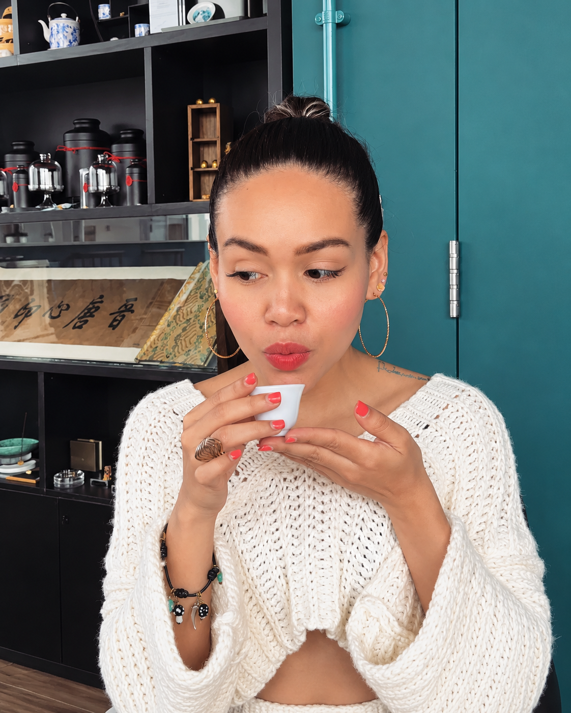 Rosi Ross tasting specialty coffee during a premium coffee experience and exploring coffee flavor and aroma.