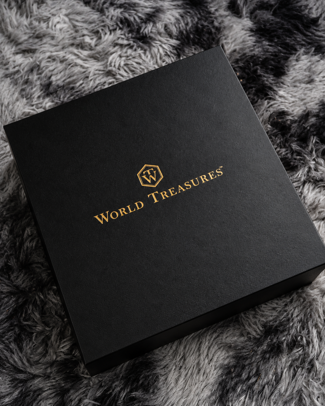 World Treasures luxury specialty coffee gift box featuring elegant black and gold packaging.