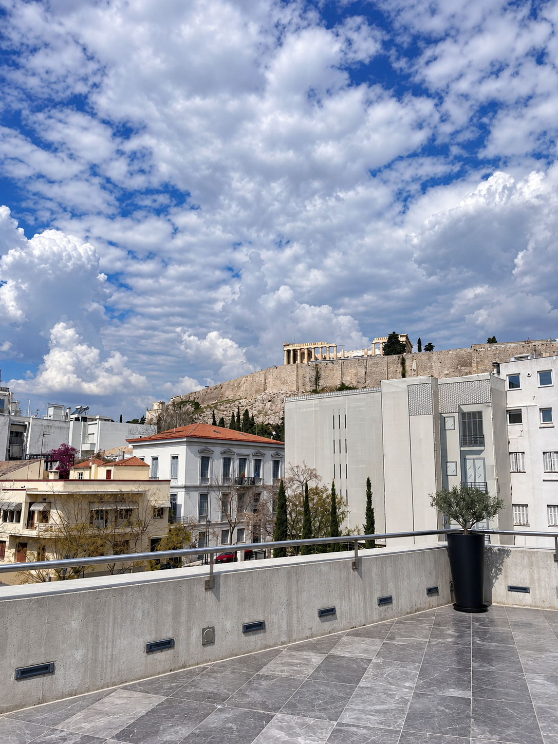 View of the Acropolis and historic Athens from the terrace of the Acropolis Museum.