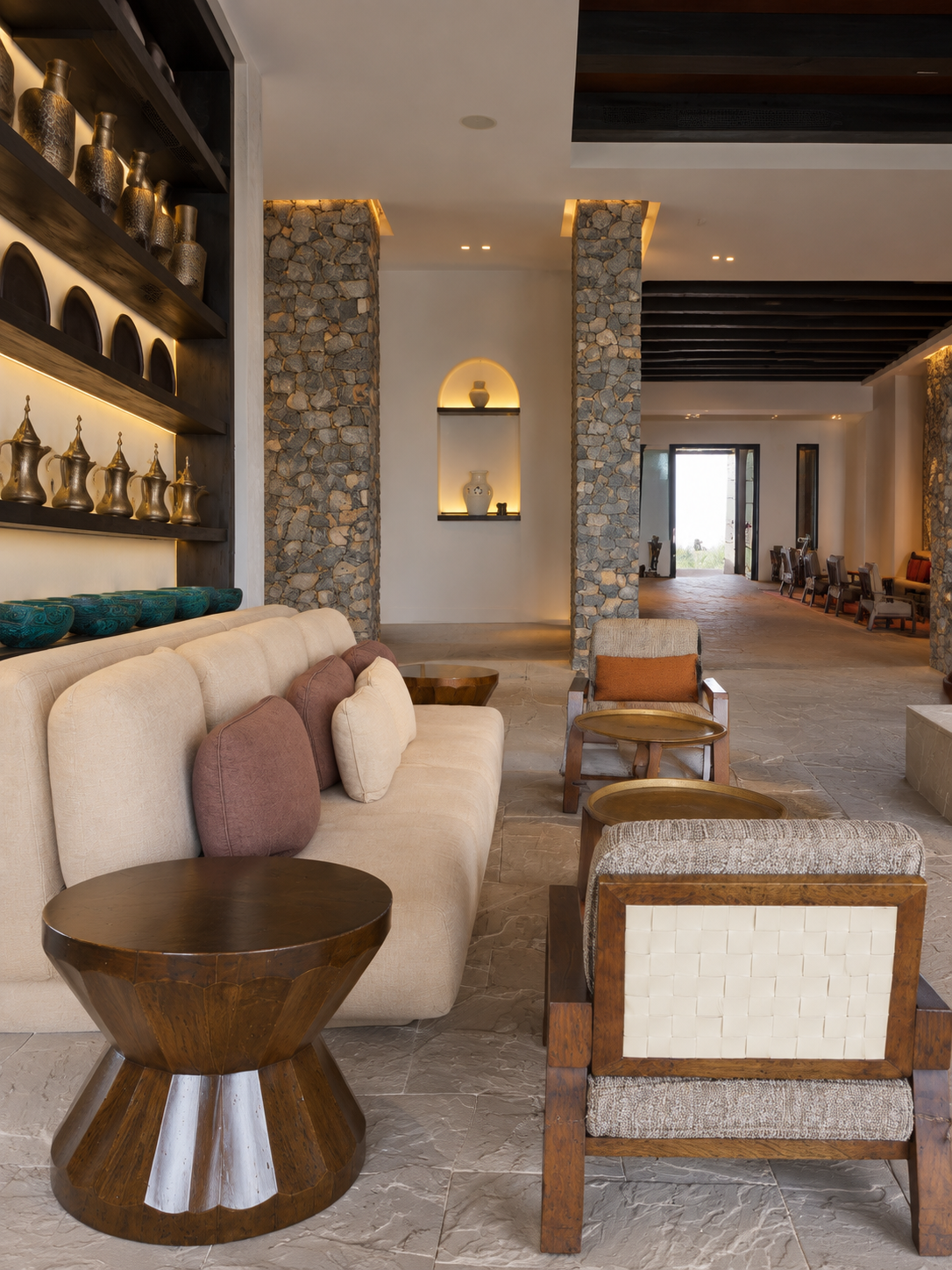 Alila Jabal Akhdar Curated Interiors Alila Jabal Akhdar Oman interior featuring natural stone, neutral furnishings, and contemporary mountain resort design.