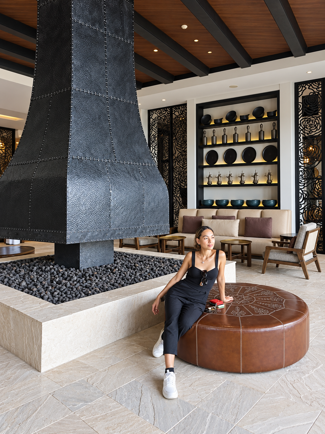 Alila Jabal Akhdar Lobby Fireplace Rosi Ross relaxing beside a contemporary fireplace inside Alila Jabal Akhdar resort in Oman.