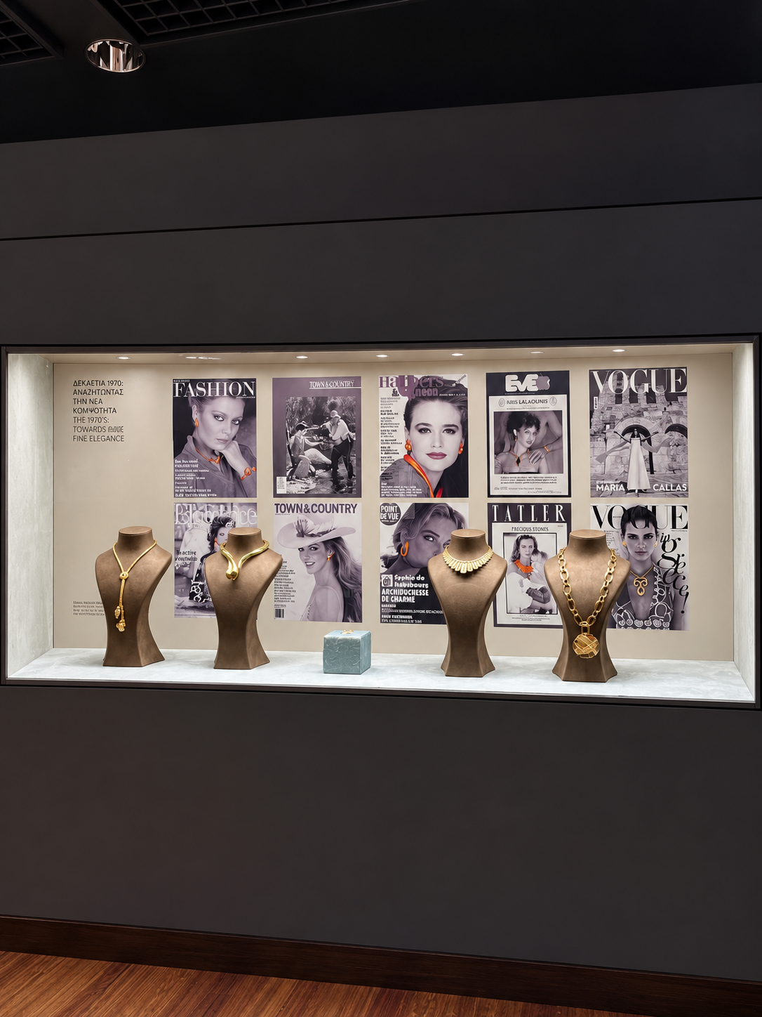 Historic fashion imagery and statement necklaces displayed at the Ilias Lalaounis Jewelry Museum in Athens.