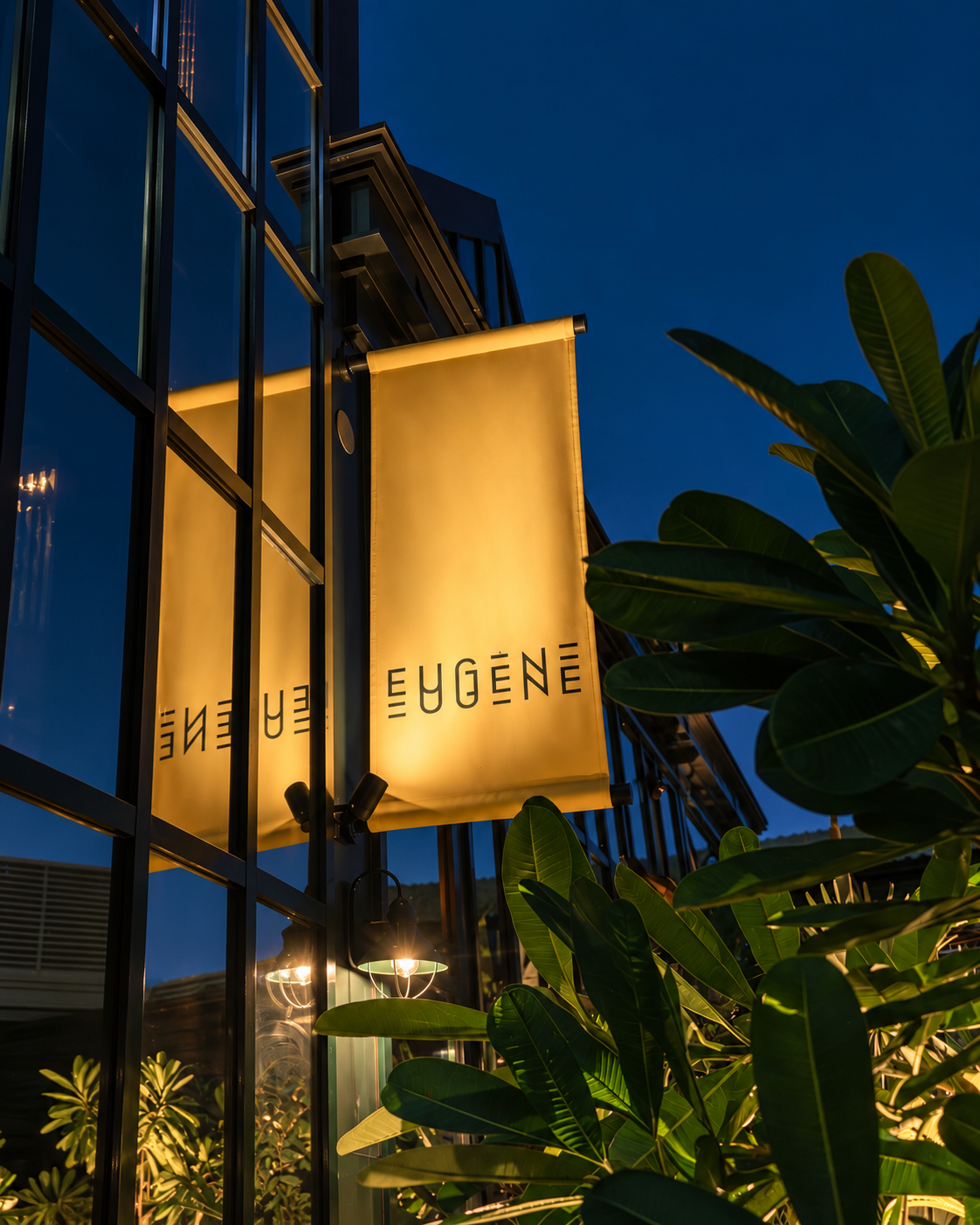 Elegant Eugene Eugene Sign at Night Illuminated Eugene sign on building exterior at night