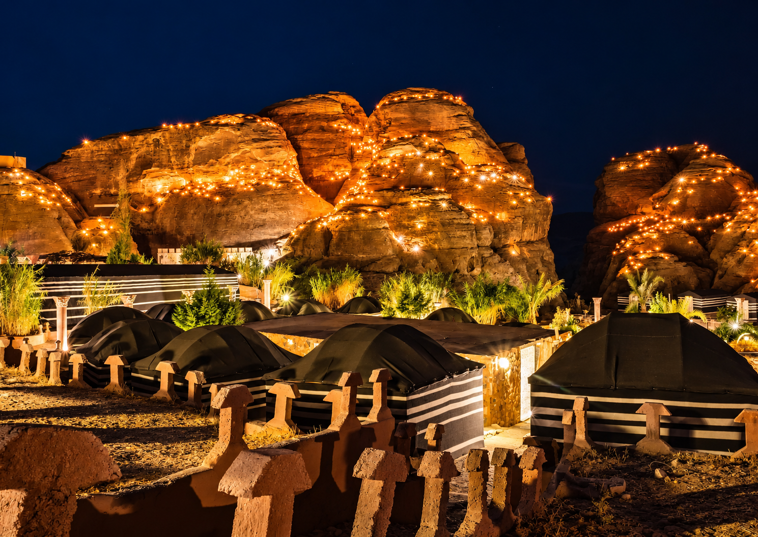 Illuminated Desert Tents at Night from Seven Wonders Luxury Camp Petra Traditional tents and illuminated rock formations at night at Seven Wonders Luxury Camp Petra