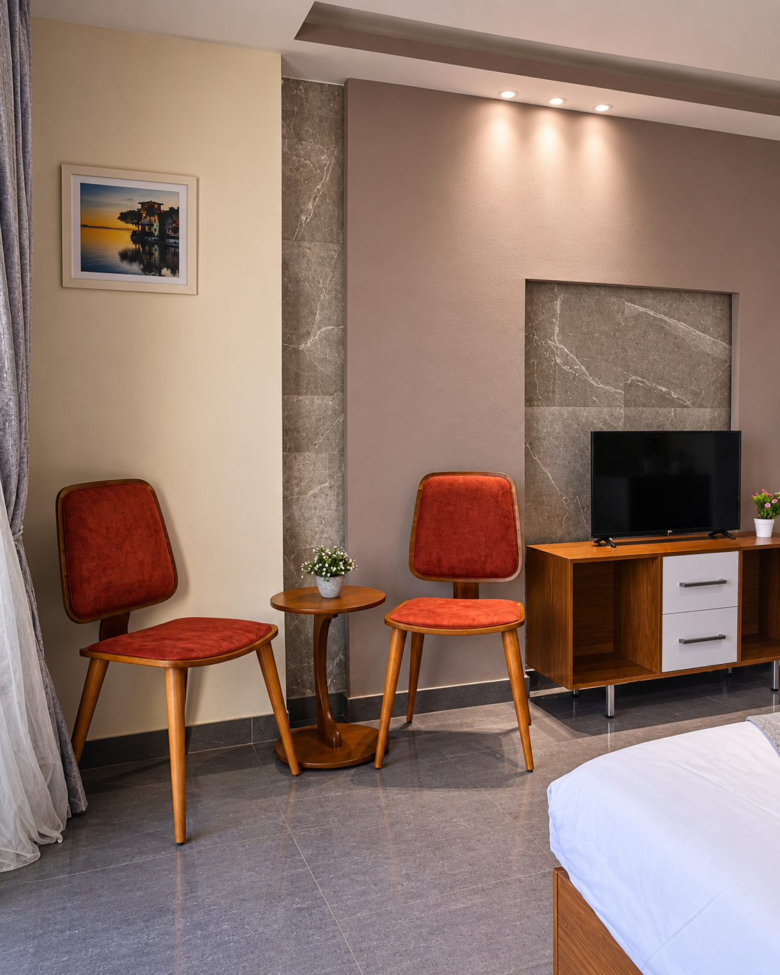 Modern Living Room Interior Design at Pyramids Inn Cairo Modern hotel room interior with red chairs and TV at Pyramids Inn Cairo
