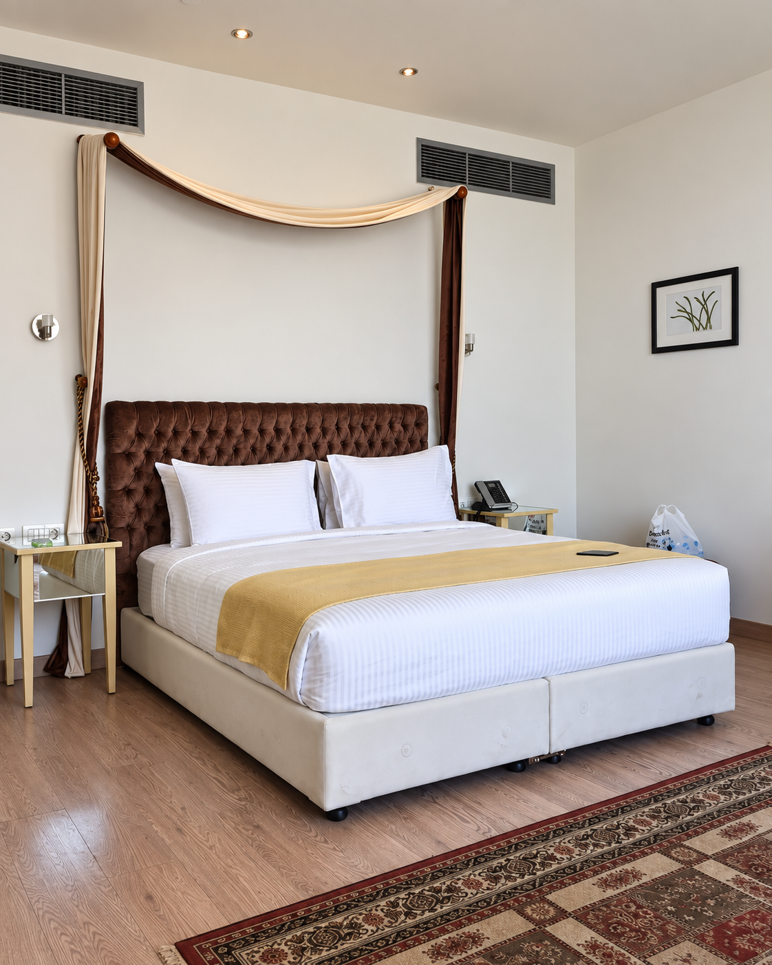 Luxurious Hotel Room with Four-Poster Bed at Riverside Hotel Cairo Elegant hotel room with a neatly made bed and warm decor at Riverside Hotel Cairo