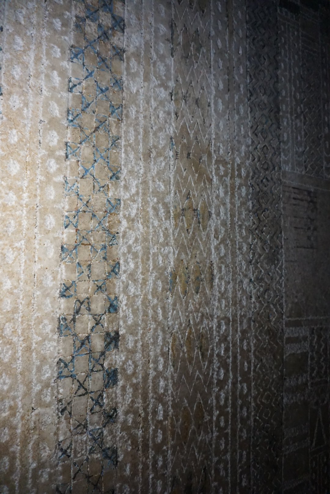 Geometric Patterns on Saqqara Wall Ancient Egyptian wall with intricate geometric patterns.