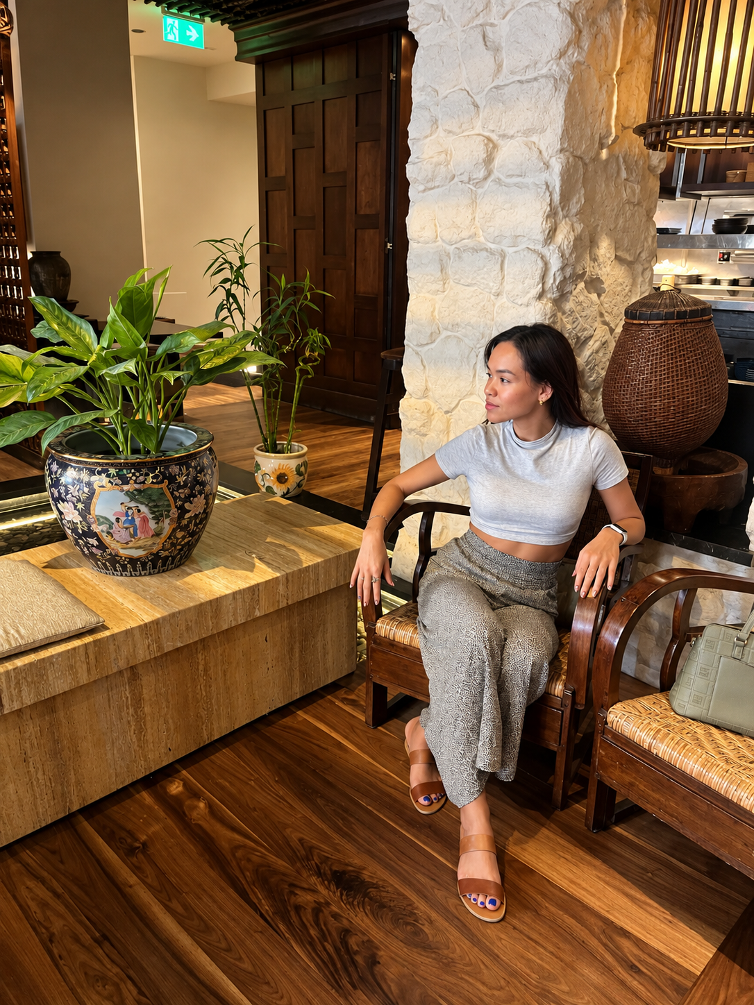 Rosi Ross in a stylish indoor setting with plant decor at the InterContinental Cairo Semiramis