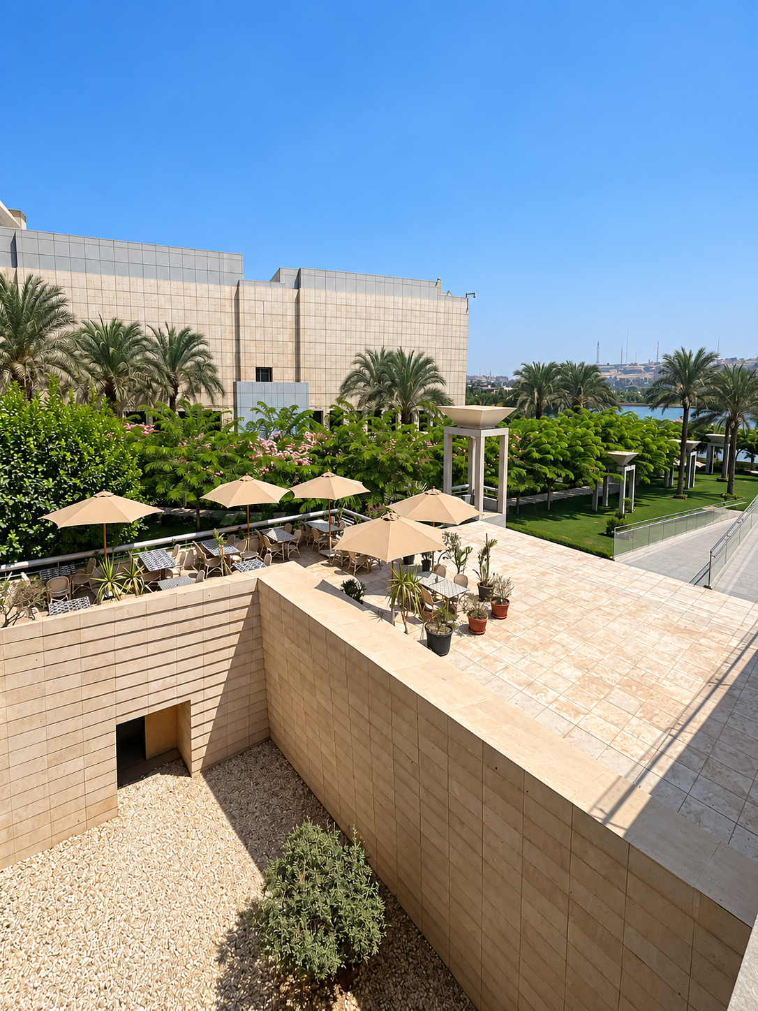 Outdoor Patio with Umbrellas at the National Museum of Egyptian Civilization's Outdoor patio area with large brick wall and umbrellas at the National Museum of Egyptian Civilization's