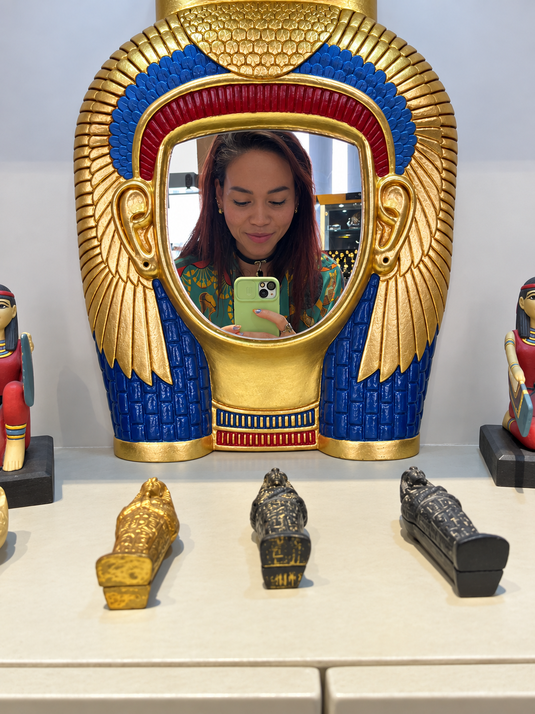 Rosi Ross funny selfie at the National Museum of Egyptian Civilization in Cairo Rosi Ross taking a selfie in an Egyptian-themed mirror at the National Museum of Egyptian Civilization in Cairo