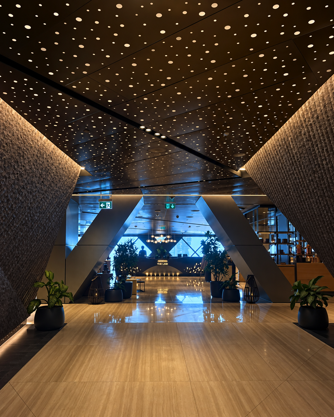 Modern One&amp;Only One Za'abeel lobby interior with illuminated starry ceiling and plants.