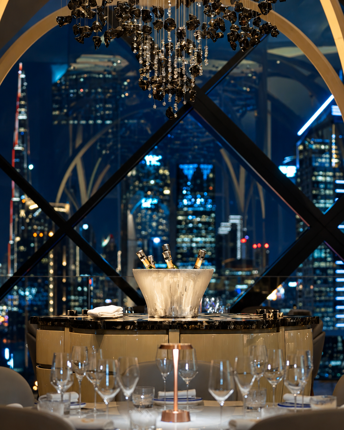 Elegant dining room with cityscape view and chandelier