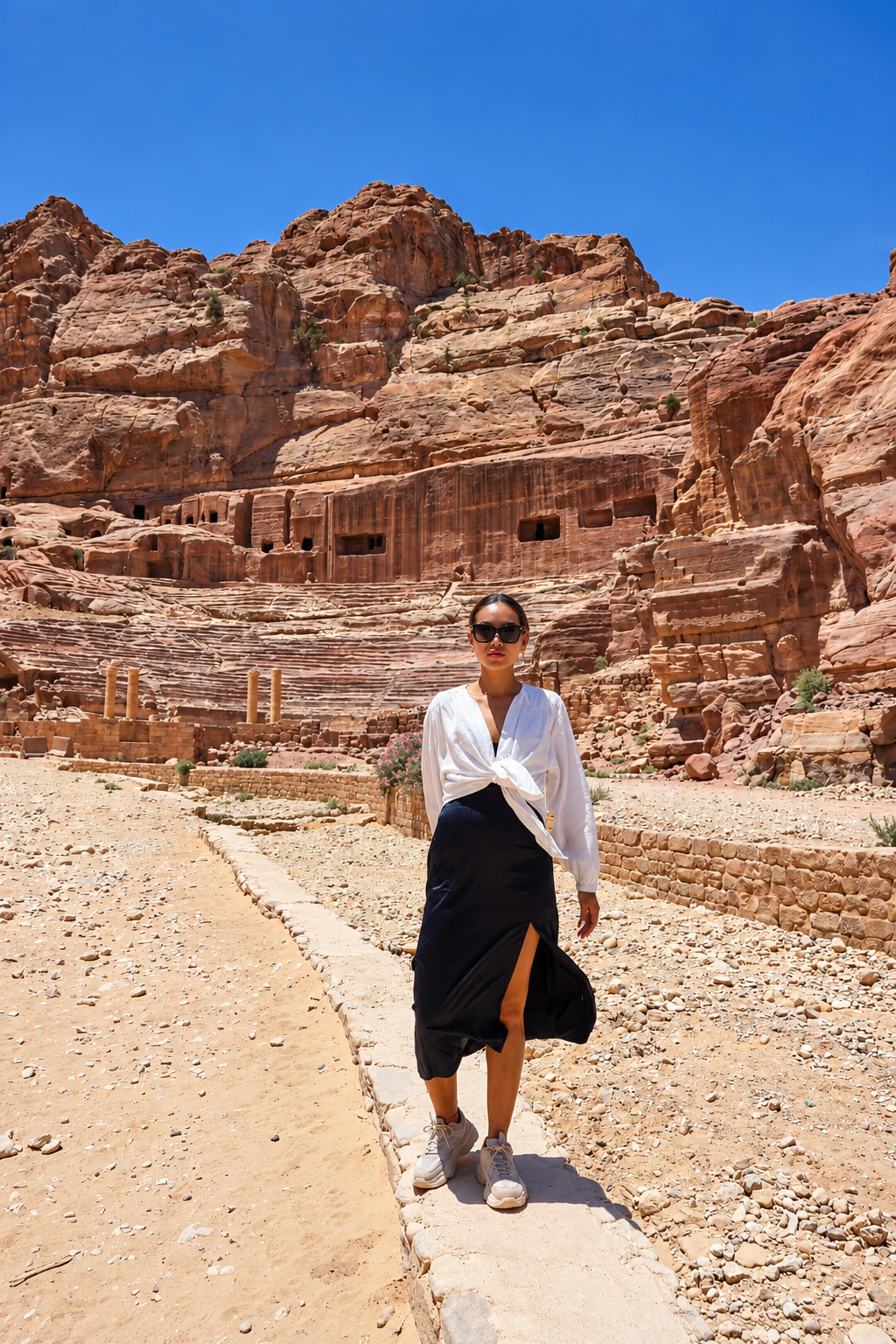Rosi Ross standing in front of Petra rock formations in Jordan