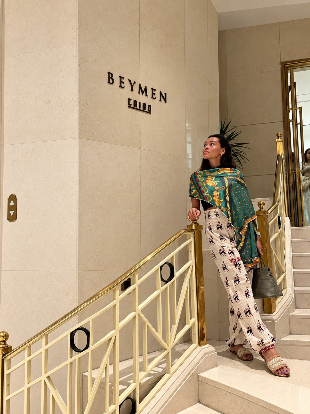 Rosi Ross standing on stairs in Beymen  at the Four Seasons Cairo