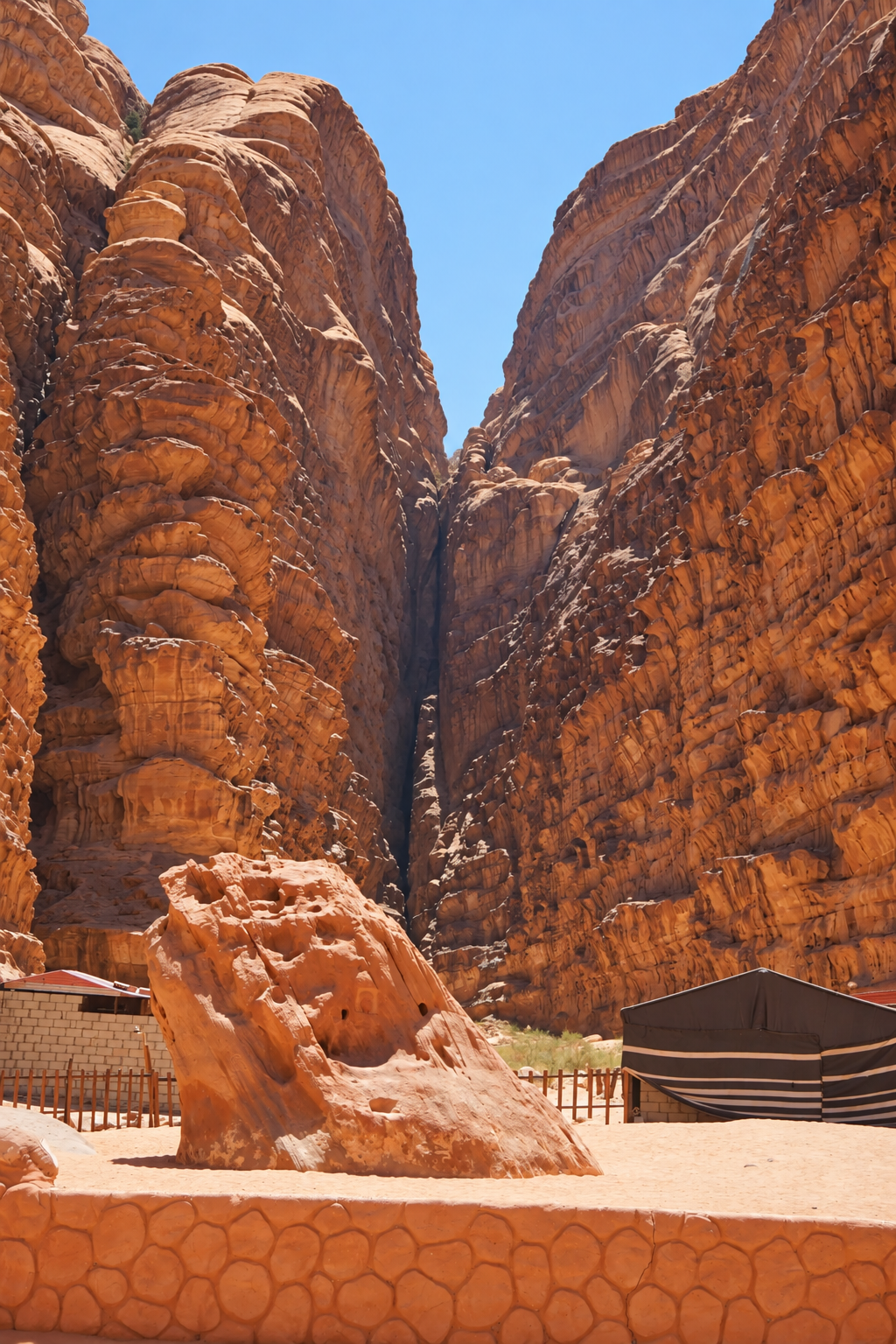 Sandstone cliffs and desert landscape in Wadi Rum, Jordan.