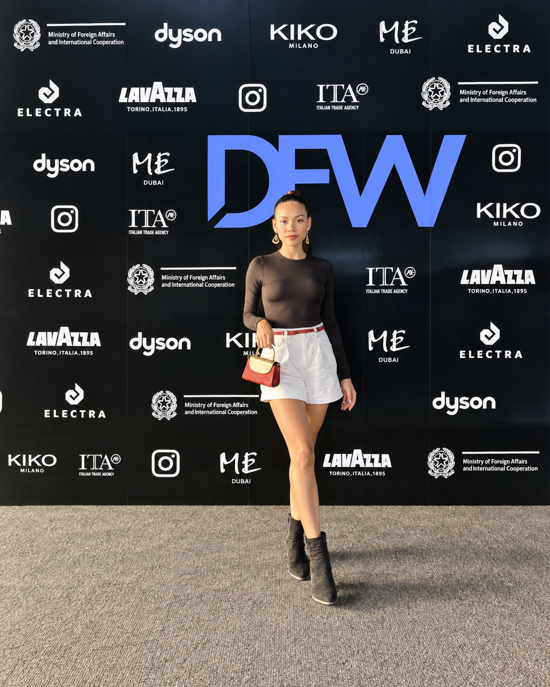 Rosi Ross at Dubai Fashion Week in a fitted structured look for Dubai Fashion Week Rosi Ross wears a polished day look balancing minimal tailoring with statement accessories for Dubai Fashion Week