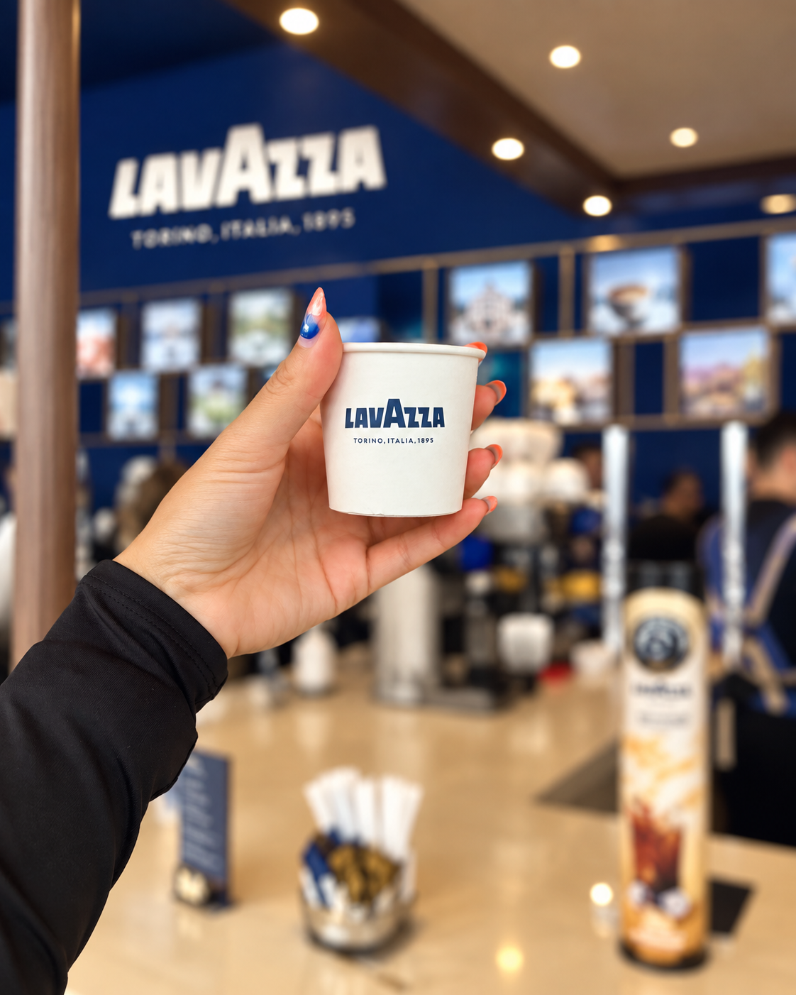 Rosi Ross holding a Lavazza espresso cup at Dubai Fashion Week Activation Rosi Ross holding a Lavazza espresso cup at Dubai Fashion Week Activation