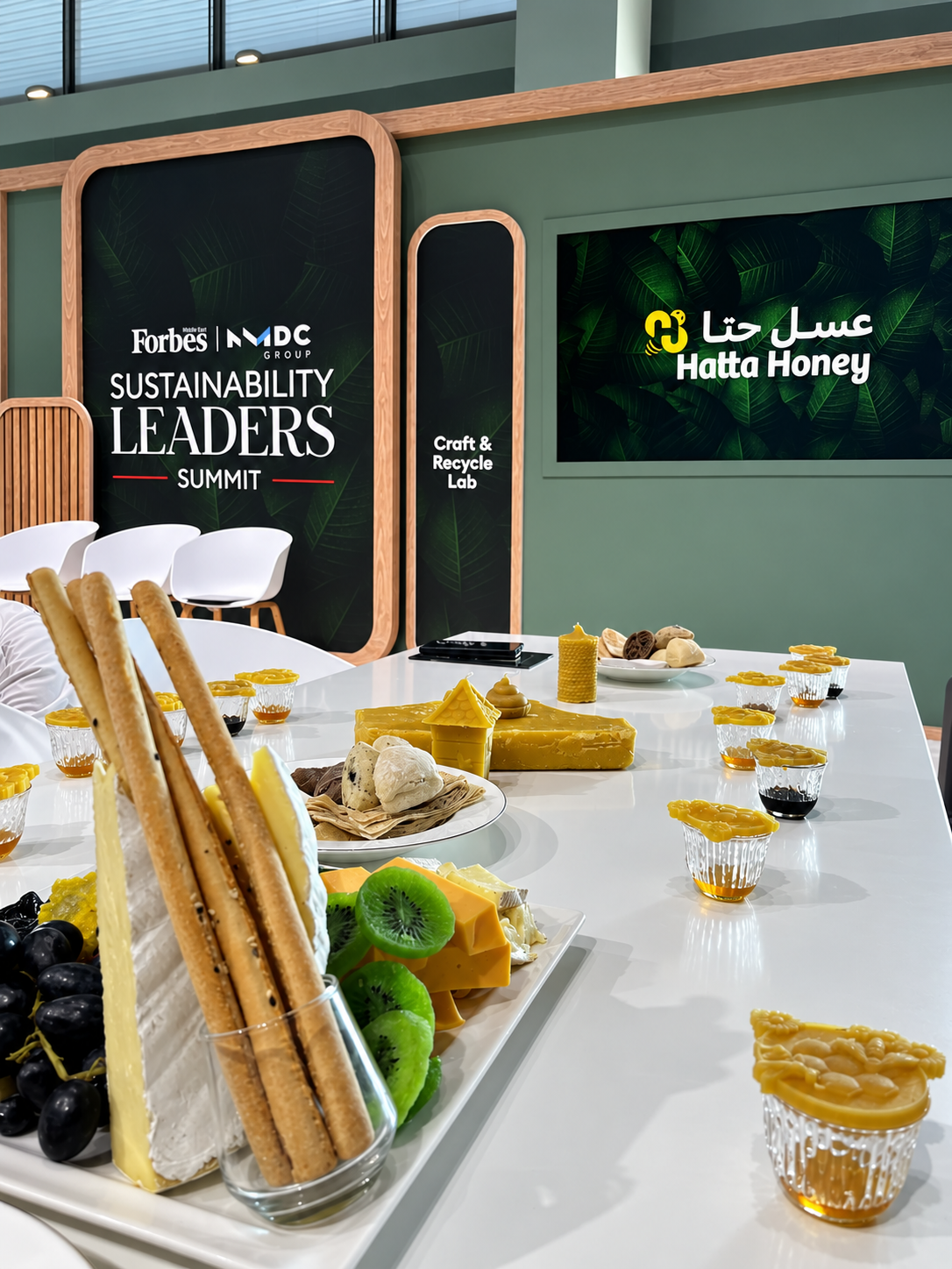 RosiRoss Forbes Sustainability Summit Workshop Hatta Honey Hatta Honey brand display at Forbes Sustainability Leaders Summit with refreshments and natural products