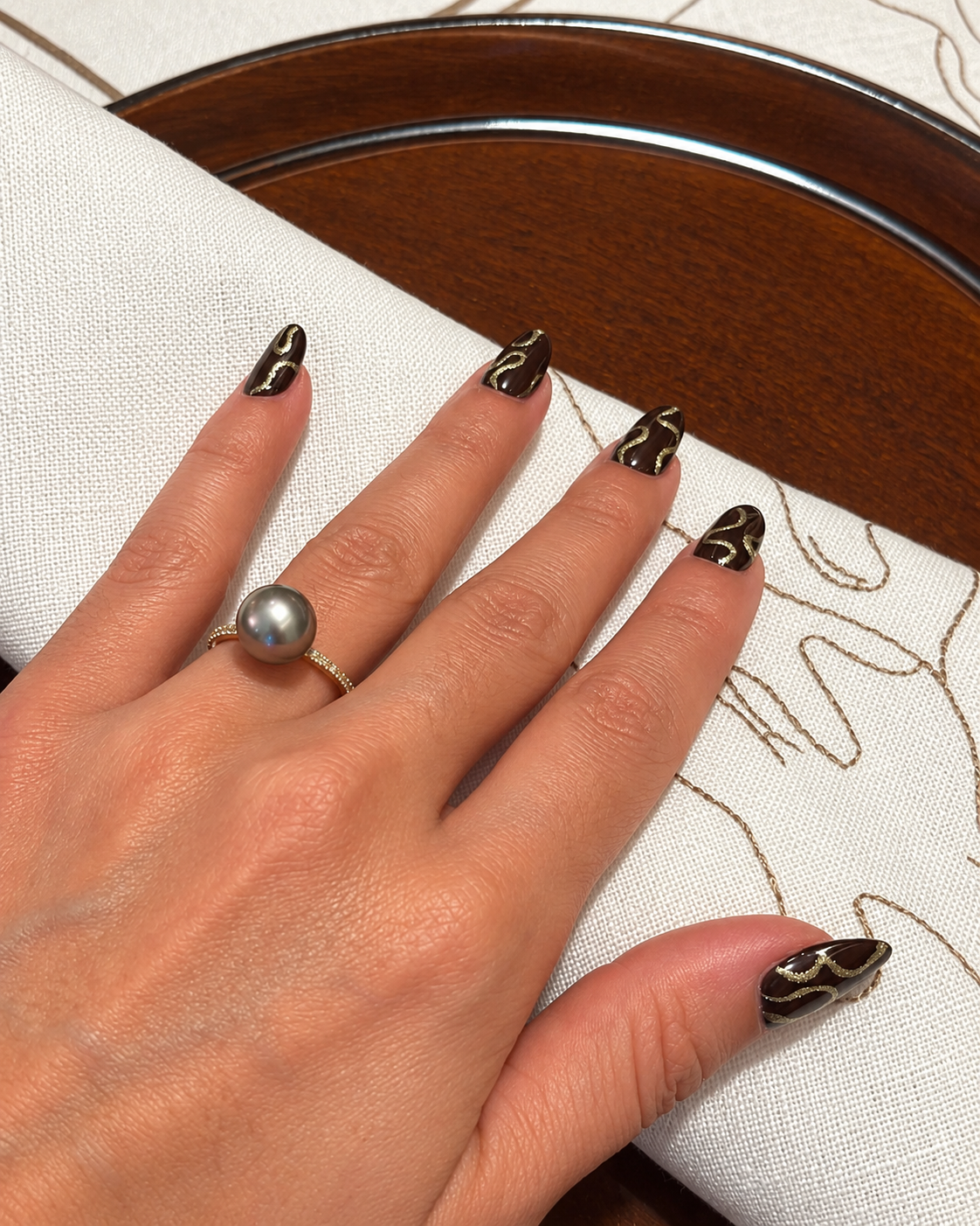 Rosi Ross Robert Wan Favorites with Black and Gold Marble Nail Art Design