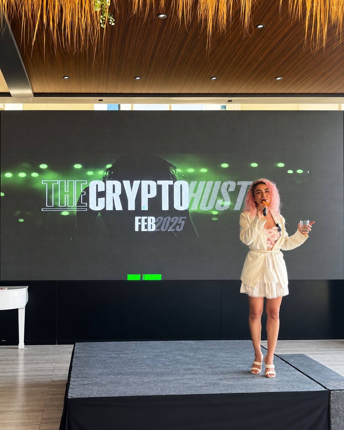 Rime Salmi introduces CryptoHustle on stage during Token2049 Dubai to industry leaders